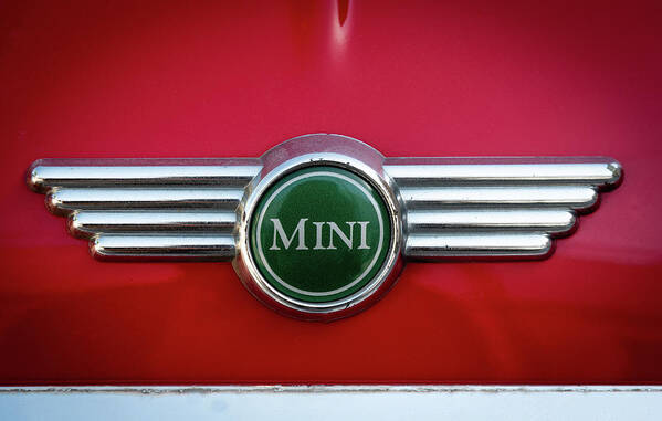 Mini Art Print featuring the photograph Mini Cooper car logo on red surface by Michalakis Ppalis