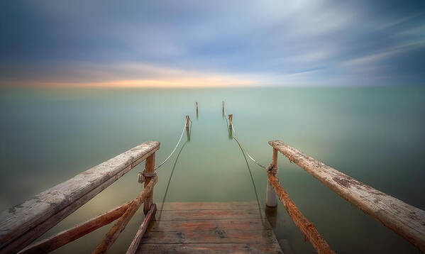 Cloud Sky Dawn Boardwalk Footbridge Day Good Material Landscape Scenery Scenics Nature Sea No People Outdoors Nature Water Pier Sunset Horizon Tranquil Scene Horizon Over Water Tranquility Beach Art Print featuring the photograph Out To Sea by Bartolome Lopez