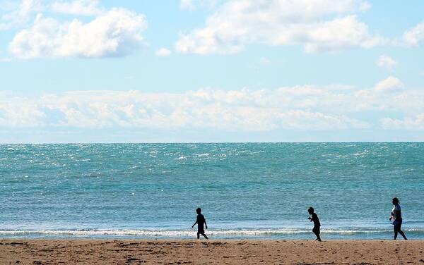 Young Men Art Print featuring the photograph Three People Walking By Coast Line by J.castro