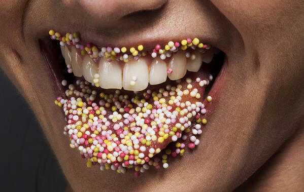People Art Print featuring the photograph Female' tongue and lips covered in sugar sprinkles by Jonathan Knowles