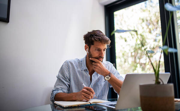 New Business Art Print featuring the photograph Man woriking from home. by MStudioImages