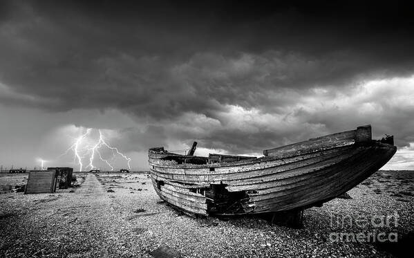 Stormy Sky Art Print featuring the photograph Stormy Dungeness, Wrecked boat on a shingle beach with lightning by Neale And Judith Clark