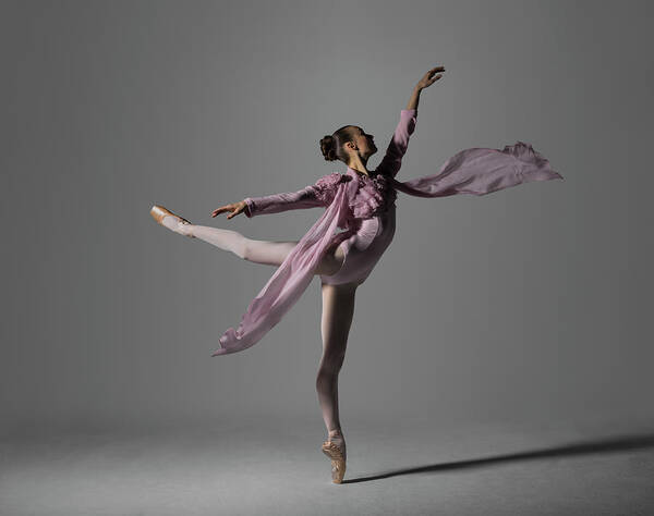 Ballet Dancer Art Print featuring the photograph Ballerina Performing Arabesque On Pointe by Nisian Hughes
