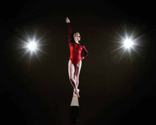 Human Arm Art Print featuring the photograph Female Gymnast On Balancing Beam by Mike Harrington