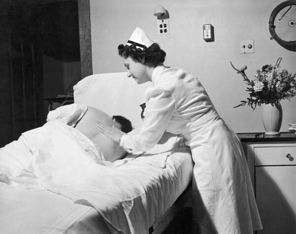 1942 Art Print featuring the photograph Nurse Gives Patient Rub Down by Underwood Archives