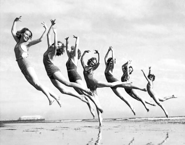 1930's Art Print featuring the photograph Graceful Line Of Beach Dancers by Underwood Archives