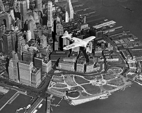 1930's Art Print featuring the photograph Hawk's Plane Over Battery Park by Underwood Archives