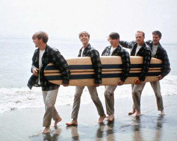 Music Art Print featuring the photograph Beach Boys On The Beach With A Surfboard by Michael Ochs Archives