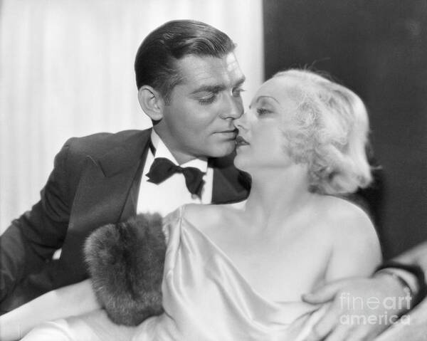 Looking Over Shoulder Art Print featuring the photograph Clark Gable And Carole Lombard Kissing by Bettmann