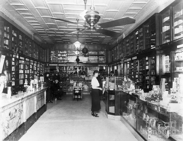 Pharmacy Art Print featuring the photograph Customers Inside Drugstore by Bettmann