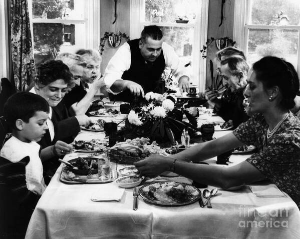 Child Art Print featuring the photograph Family Having Thanksgiving Dinner by Bettmann