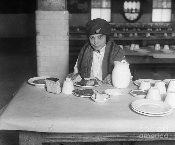 People Art Print featuring the photograph Immigrant Eating Meal On Ellis Island by Bettmann