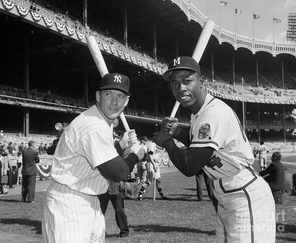 People Art Print featuring the photograph Mickey Mantle And Hank Aaron Holding by Bettmann