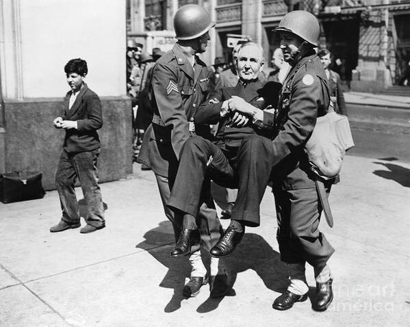 People Art Print featuring the photograph Sewell Avery Carried By Two Soldiers by Bettmann