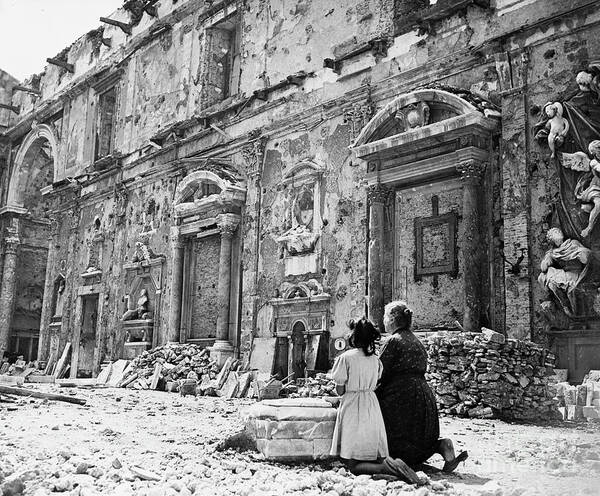 People Art Print featuring the photograph Woman & Girl Kneeling At Ruined Church by Bettmann