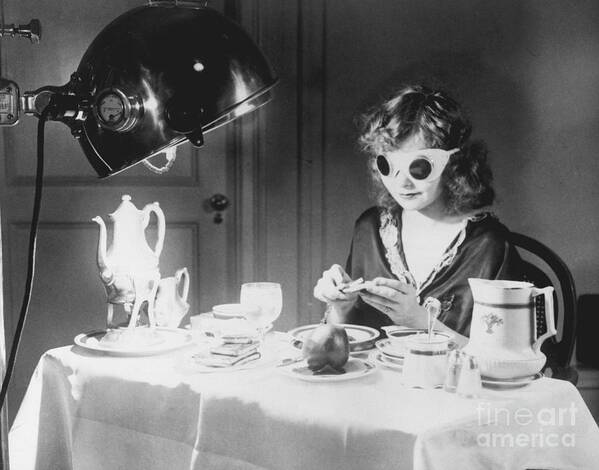 People Art Print featuring the photograph Woman Eating Meal Under An Ultraviolet by Bettmann