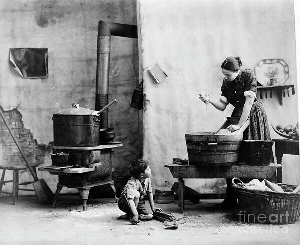 People Art Print featuring the photograph Woman Washing Boy On Floor Kitchen by Bettmann