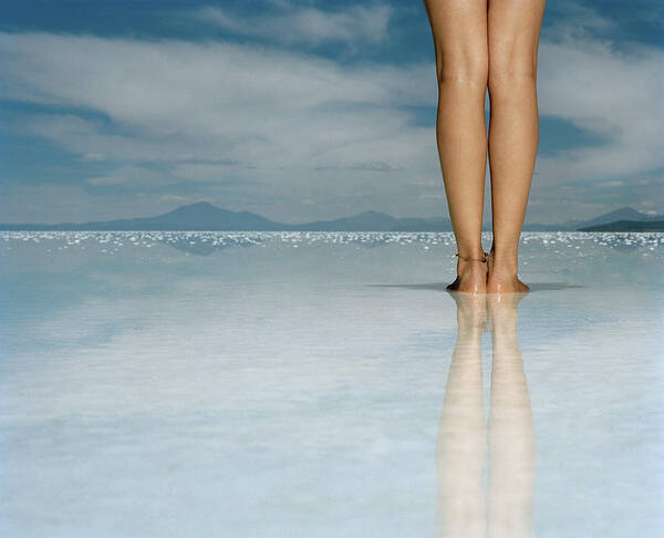 Mystery Art Print featuring the photograph Young Woman Standing On Salt Flat, Low by Matthias Clamer