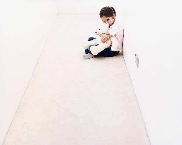 4-5 Years Art Print featuring the photograph Young Girl Sitting Alone in a Corridor and Hugging a Cuddly Toy by Dylan Ellis
