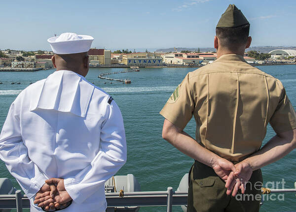 Uss Boxer Art Print featuring the photograph A Sailor And Marine Man The Rails by Stocktrek Images