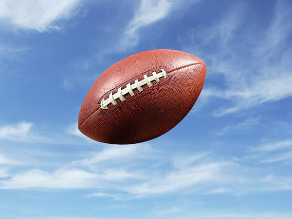 American Football Art Print featuring the photograph American Football Flying Mid-air by Steven Puetzer