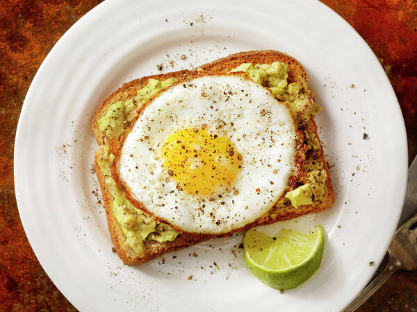 Breakfast Art Print featuring the photograph Avocado Toast With A Fried Egg by Lauripatterson