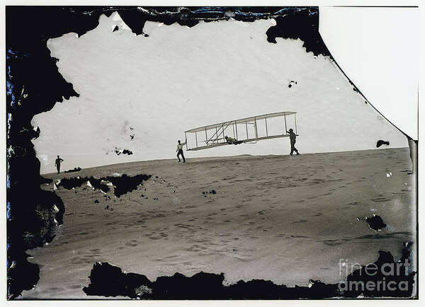 The Wright Brothers Art Print featuring the photograph The Wright Brothers Wilbur in motion at left holding one end of glider by Vintage Collectables