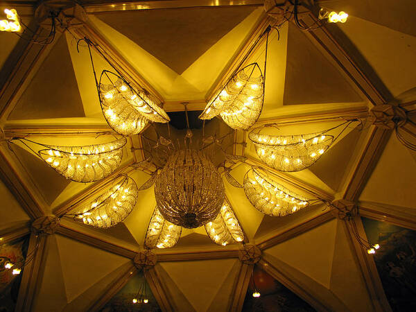 Temple Art Print featuring the photograph The beautifully lit chandelier on the ceiling of the ISKCON temple in Delhi by Ashish Agarwal