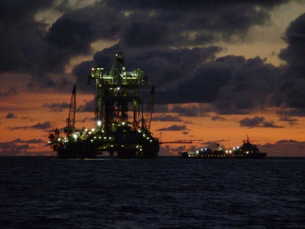 Off Shore Art Print featuring the photograph Drill Rig at Dusk by Charles and Melisa Morrison