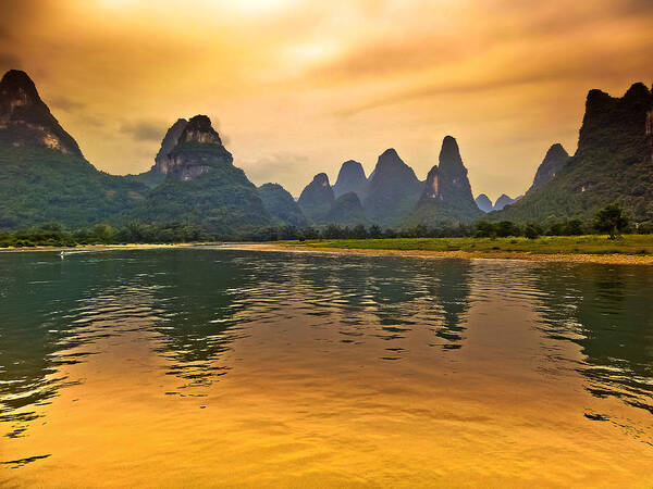 Sunset Art Print featuring the photograph Bathing in the golden landscape-China Guilin scenery Lijiang River in Yangshuo by Artto Pan