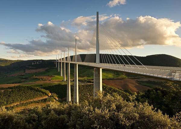 Millau Art Print featuring the photograph Golden light hits the Millau viaduct by Stephen Taylor