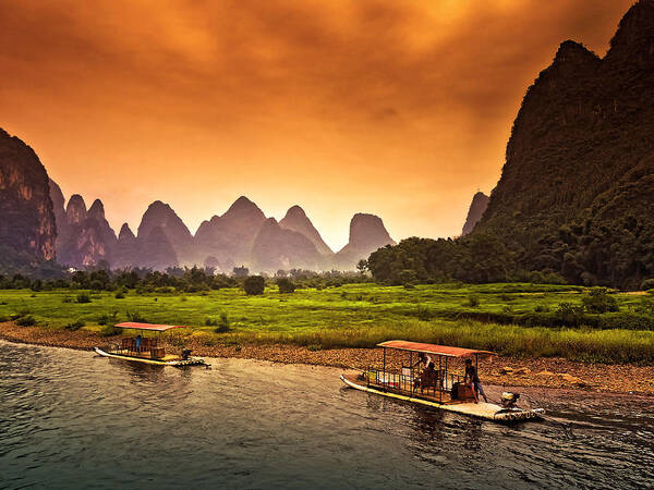 Sunset Art Print featuring the photograph Home boat in red evening glow-China Guilin scenery Lijiang River in Yangshuo by Artto Pan