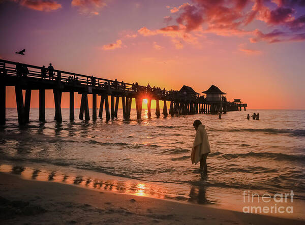 Sunsets Art Print featuring the photograph Little girl on the beach at sunset by Claudia M Photography