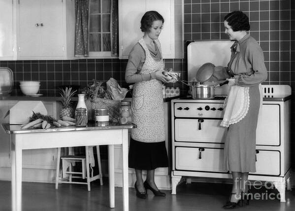 Adults Art Print featuring the photograph Women Cooking In Kitchen, C.1930s by H. Armstrong Roberts/ClassicStock