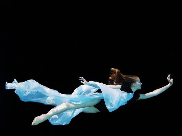 Ballet Dancer Art Print featuring the photograph Female Dancer Underwater Against Black by Thomas Barwick