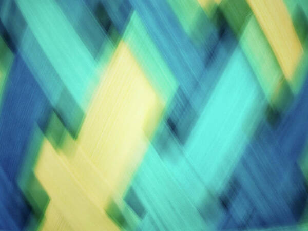 Abstract Art Print featuring the photograph Bright blue, turquoise, green and yellow blurred diamond shapes abstract by Teri Virbickis