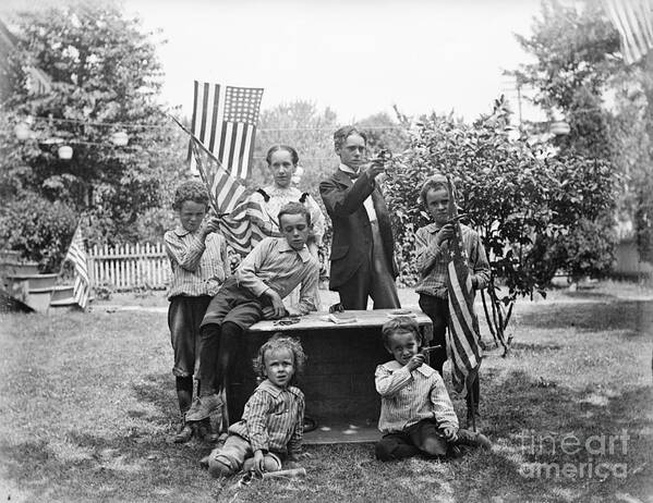 Child Art Print featuring the photograph Children With Flags, Guns 4th Of July by Bettmann