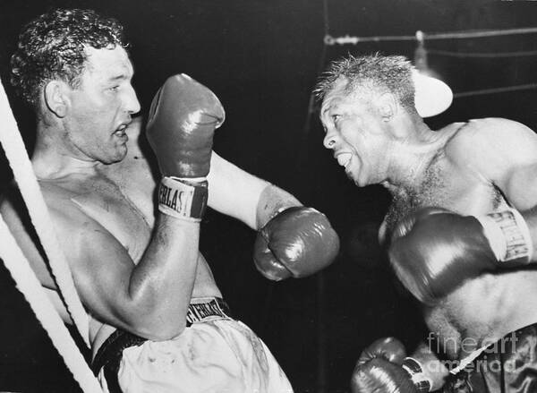 People Art Print featuring the photograph James Parker Blocking Archie Moore Punch by Bettmann