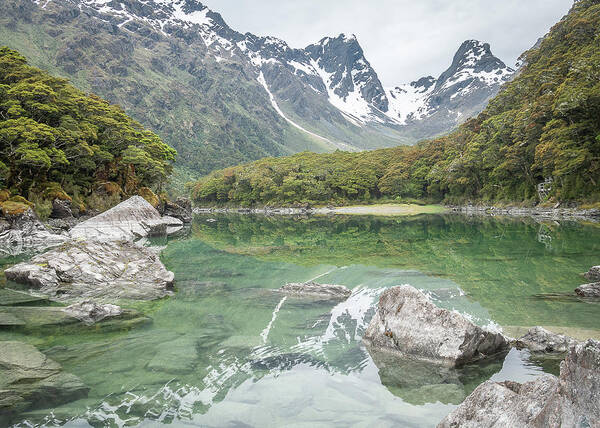 Nature Art Print featuring the photograph Pristine Alpine Lake With Mountain Backdrop In New Zealand by Peter Kolejak