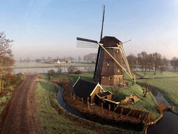 North Holland Art Print featuring the photograph Old Dutch Windmill Near Amsterdam by Photo By Fabfoto