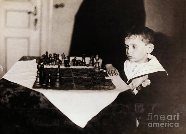 Child Art Print featuring the photograph Samuel Rzeschewski Playing Chess by Bettmann