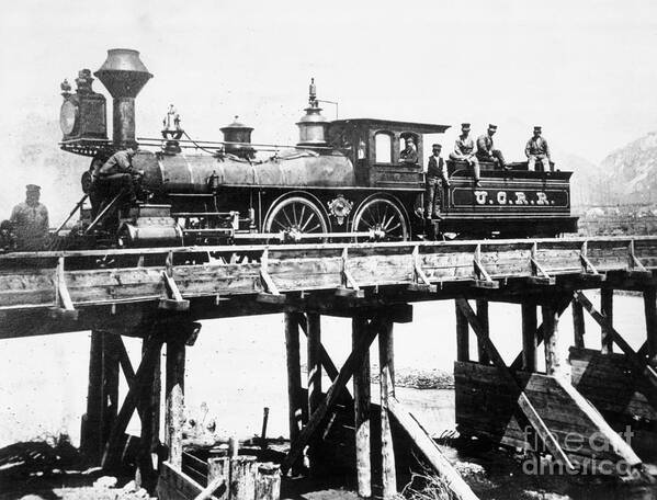 Civil Engineering Art Print featuring the photograph Steam Locomotive Passing Over Trestle by Bettmann