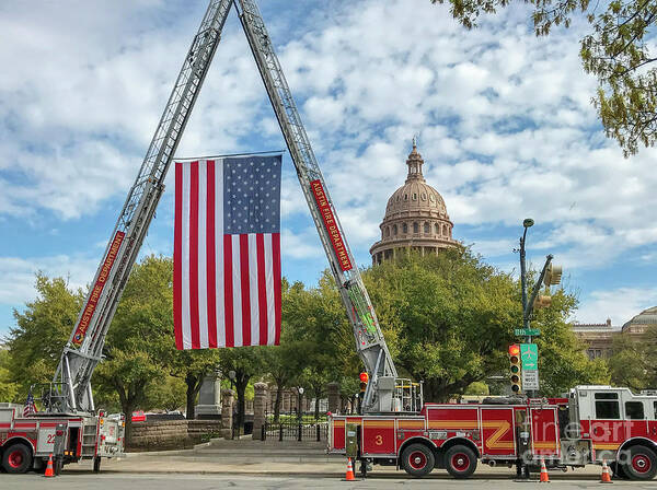 View Art Print featuring the photograph The US flag is hoisted by cranes on the Austin Fire Department f by Dan Herron