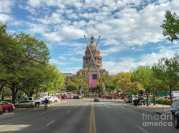 Austin Fire Department Art Print featuring the photograph View from Congress Avenue of the US flag hoisted by cranes on th by Dan Herron