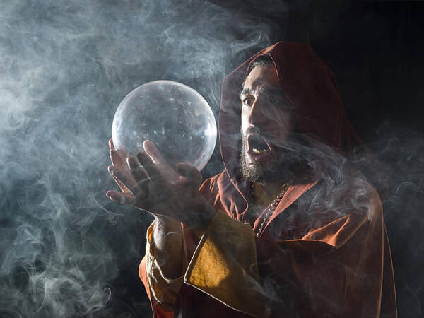 Smoking Art Print featuring the photograph Fortune teller in fantastical costume holding crystal ball #1 by Selimaksan