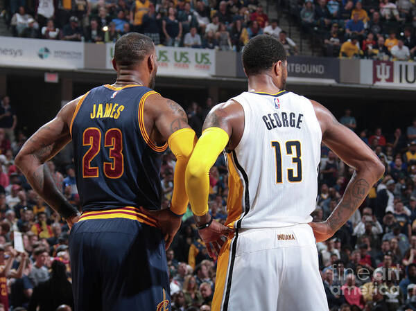 Playoffs Art Print featuring the photograph Paul George and Lebron James by Ron Hoskins