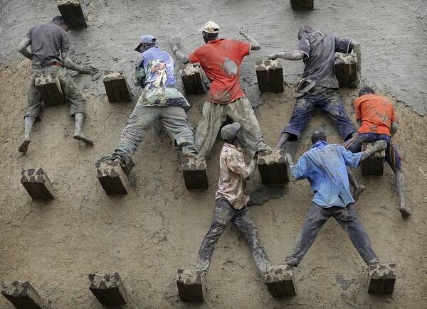 People Art Print featuring the photograph Men replaster the great mud Mosque, Djenne, Mali #2 by Timothy Allen