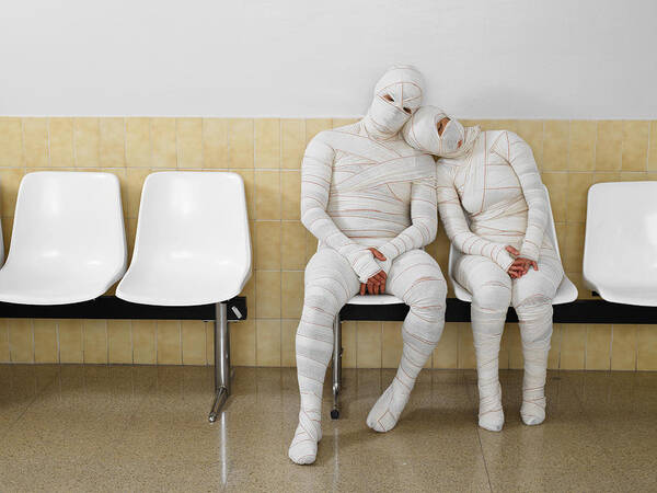 Heterosexual Couple Art Print featuring the photograph Couple wrapped in bandages leaning together by Michael Blann