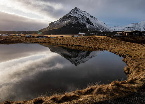 Arnarstapi Art Print featuring the photograph Mountain landscape at and hilltop reflection at a lake. by Michalakis Ppalis
