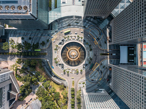 Art Art Print featuring the photograph Top view of the Fountain of Wealth as the largest fountain in the world at Singapore. It is located in one of Singapore largest shopping malls. by Mongkol Chuewong